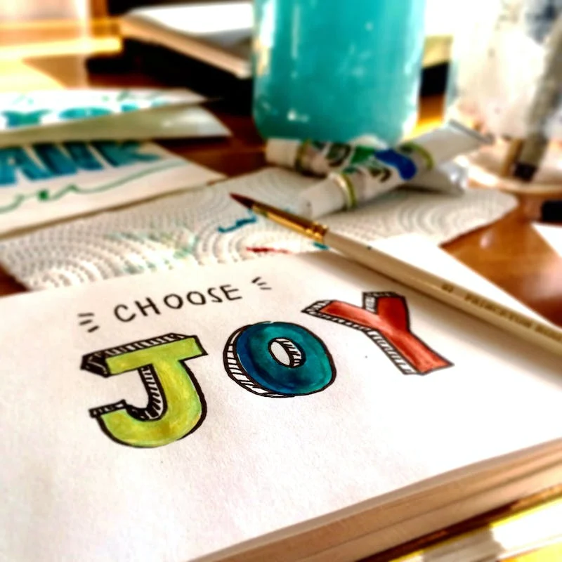 A book with the word " joy " written on it.